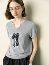 Notched V-Neck Graphic Knit Short Sleeve Top